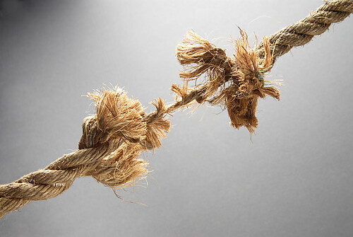 A length of rope almost broken with the strain